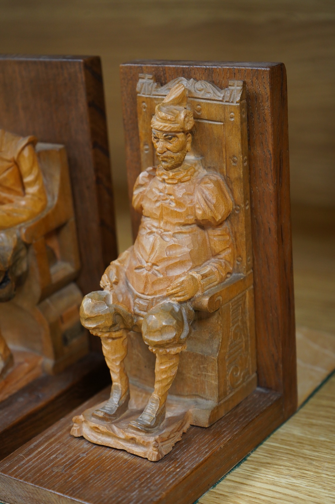 A pair of Bavarian carved wood figural bookends, 17cm high